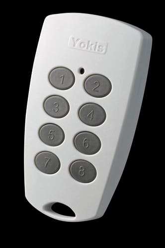 URMET - Telecomando TLC8C Radio con 8 pulsanti indipendenti, sistema Radio Power, portachiavi, colore legno. 5454403